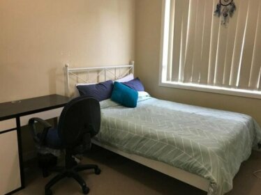 A large double bed room in a guesthouse in Oakleigh