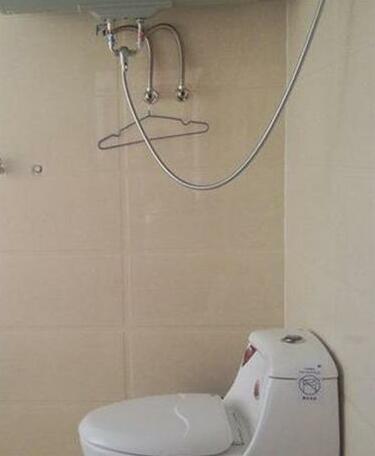 Sanjiaodi Hotel - Photo4