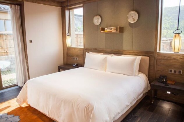 Qu Fu Ni Shan Akadmeid Hotel - Photo4