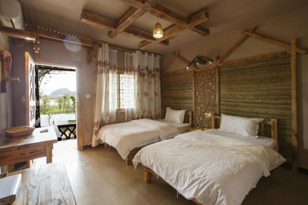 Puzhehei Yanhu Guesthouse - Photo2