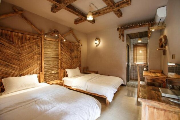 Puzhehei Yanhu Guesthouse - Photo4