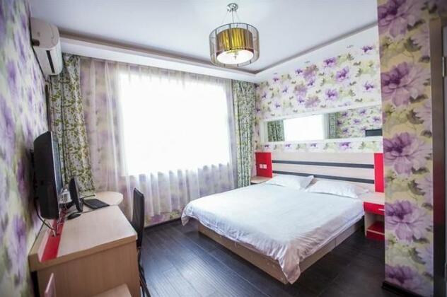 Qingdao Aisen Apartment Hotel - Photo2