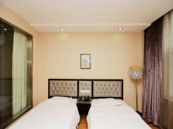 Qingdao Sheng Shi Business Hotel - Photo4