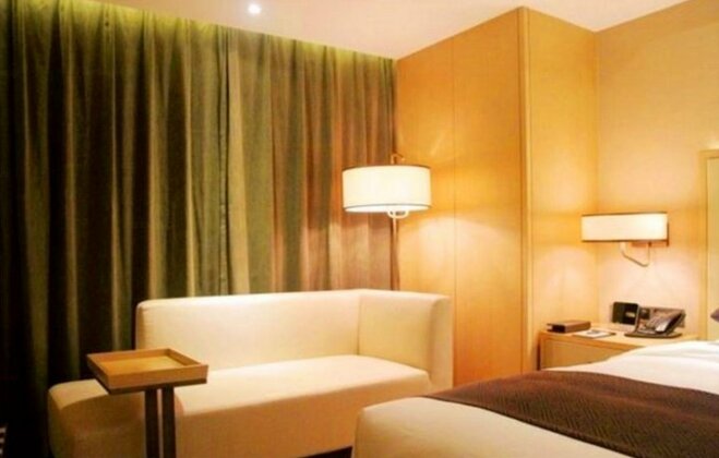 Sky World Hotel Qingdao - Photo4
