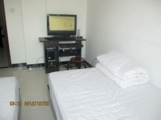 Family Hotel Xijing Apartment - Photo2