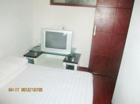 Family Hotel Xijing Apartment - Photo4