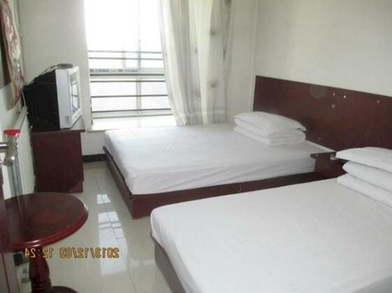 Family Hotel Xijing Apartment - Photo5