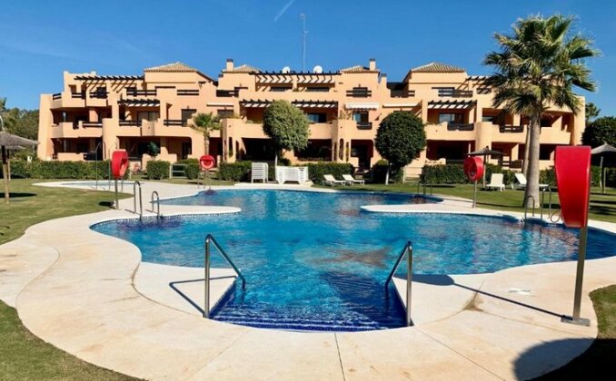 Casares Beach Golf Apartment with private garden and pool access