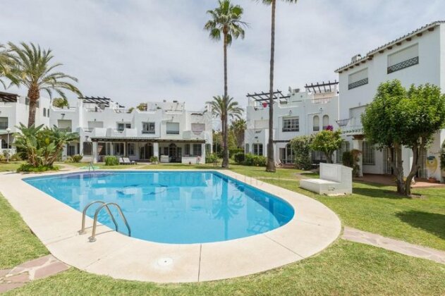 Nueva Andalucia Beach House by Dahlia Group