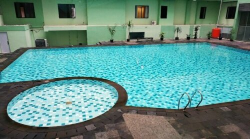 Homey 2BR at Menteng Square Apartment By Travelio