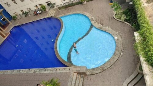 New Furnished 2BR With Sofa Bed Green Pramuka Apartment By Travelio