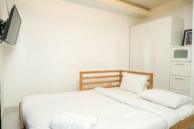 Simply White and Compact Studio at Amethyst Apartment By Travelio - Photo2