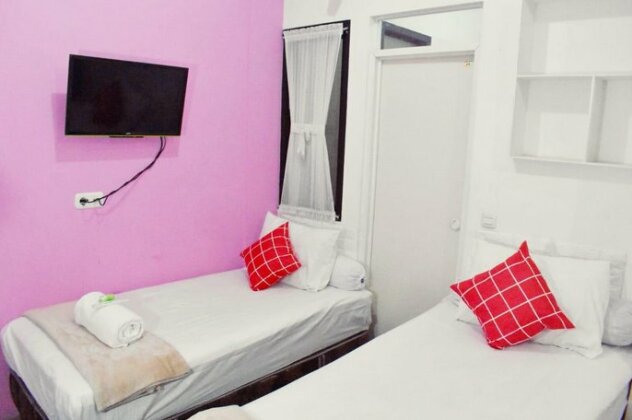 Griya Rattu Kost N Guesthouse - Photo5