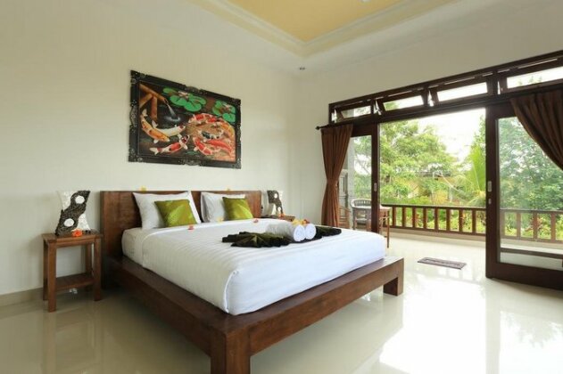 Putra Bisma Guesthouse - Photo4