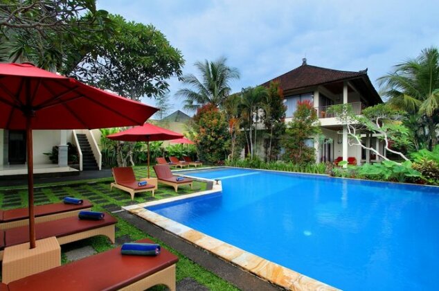Putri Ayu Cottages - Photo2