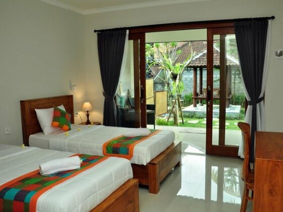 Putu's Paradise Guesthouse - Photo4