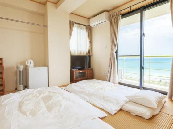 Kariyushi Condominium Ocean Hills Chouraku Stay - Photo3