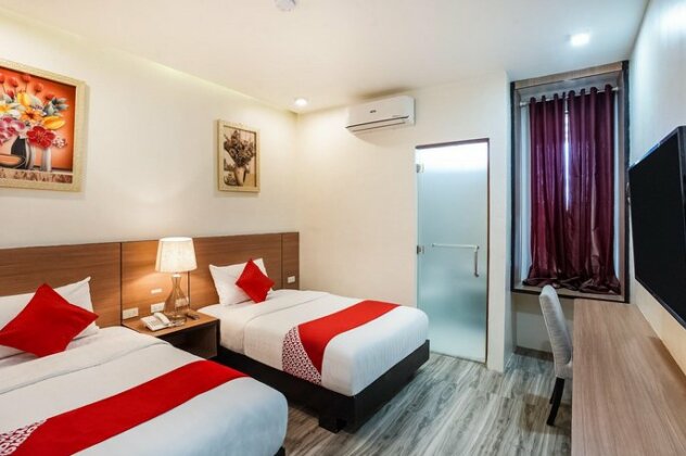 OYO 489 Casa Mia Hotel Suites - Photo4