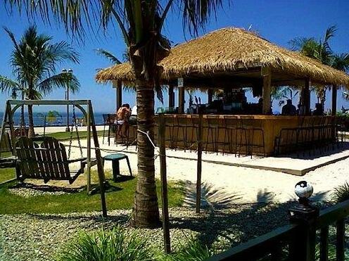 A view of the beach front promenade from the outside tiki bar at the Ocean  Place Resort and Spa, Long Branch, New Jersey, USA.